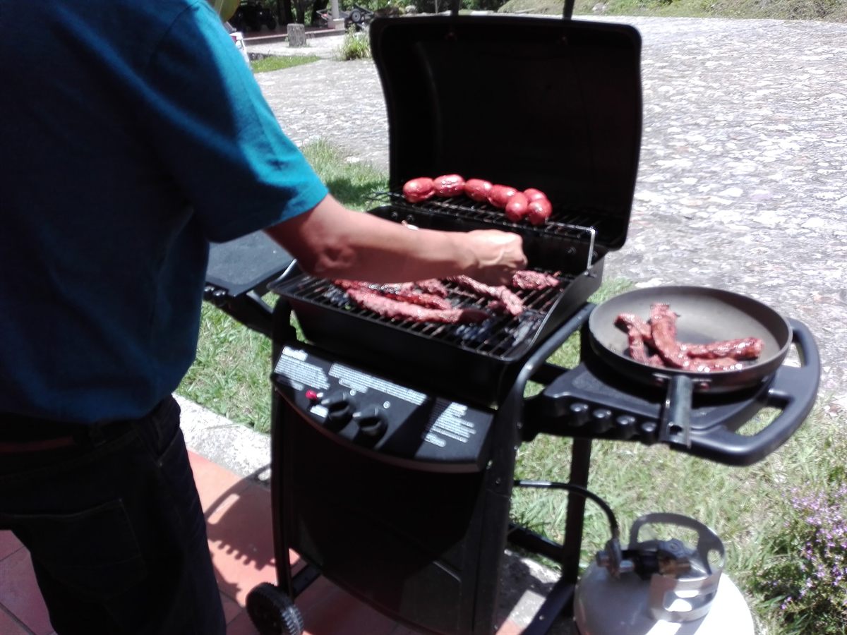 Meat cooking on the gas grill