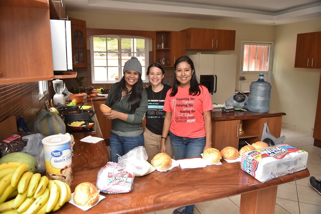 Campers preparing food in the kitchen