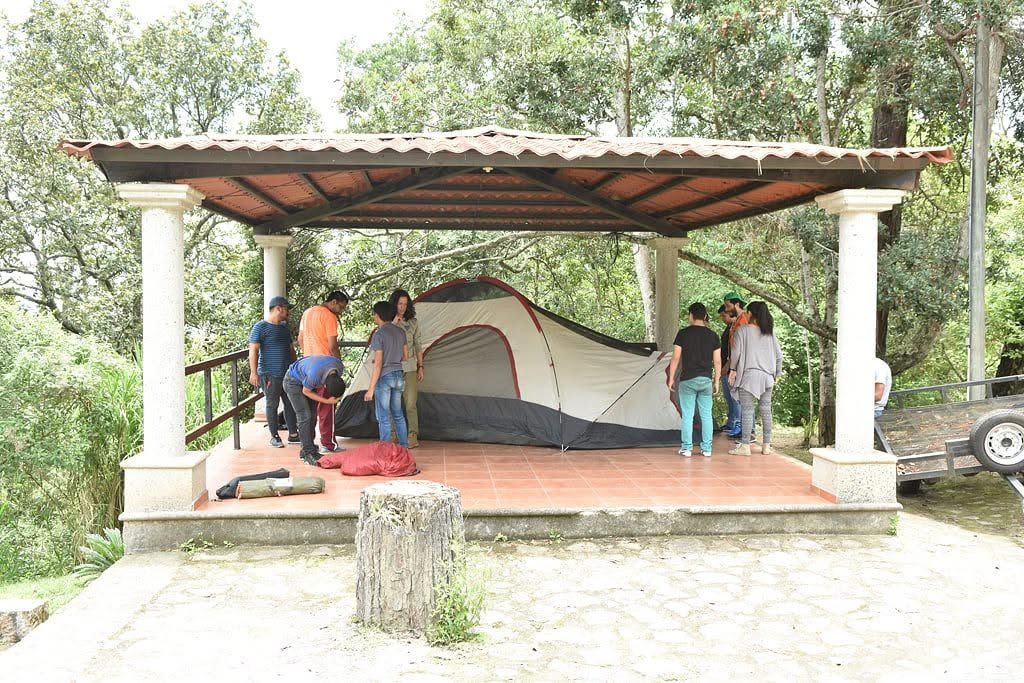 A tent set up under the garden kiosk
