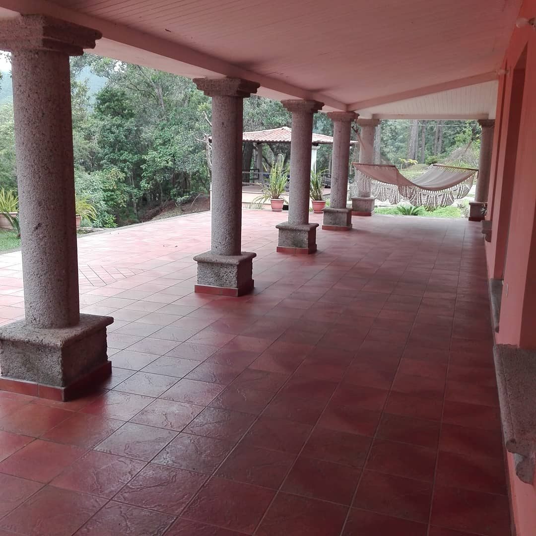 Porch with granite columns and hammocks