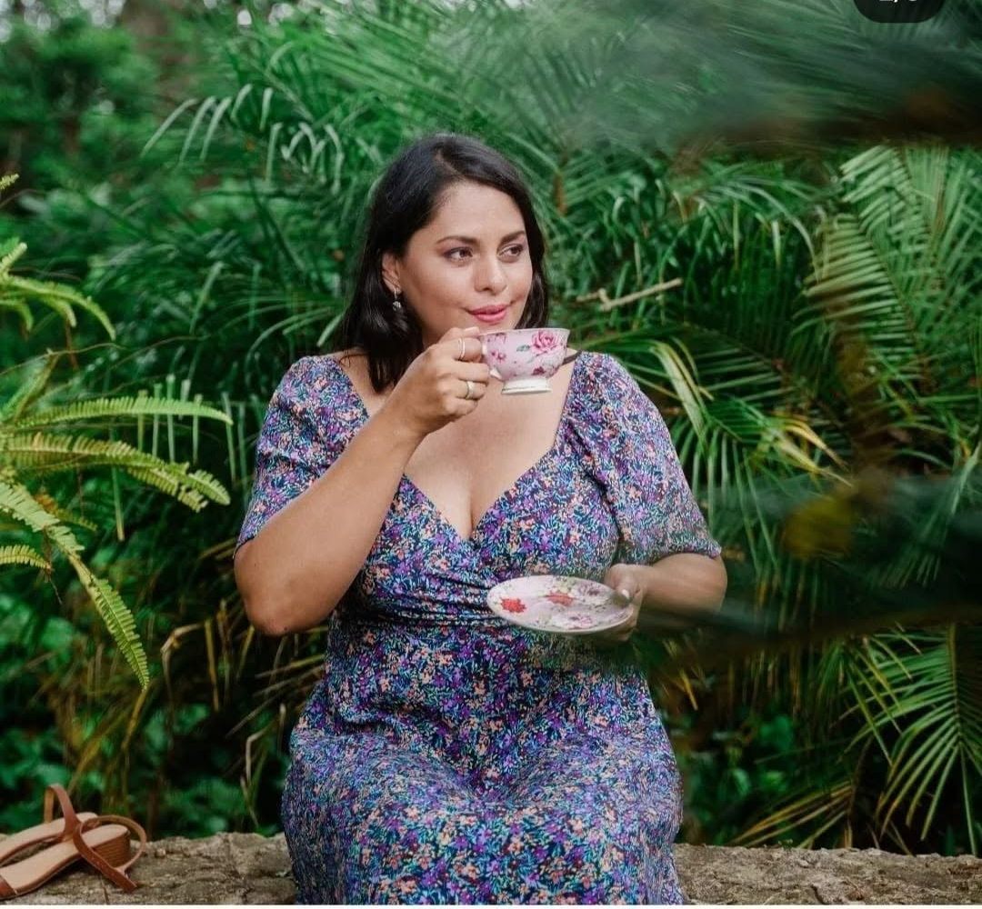 A guest enjoying afternoon tea in the garden